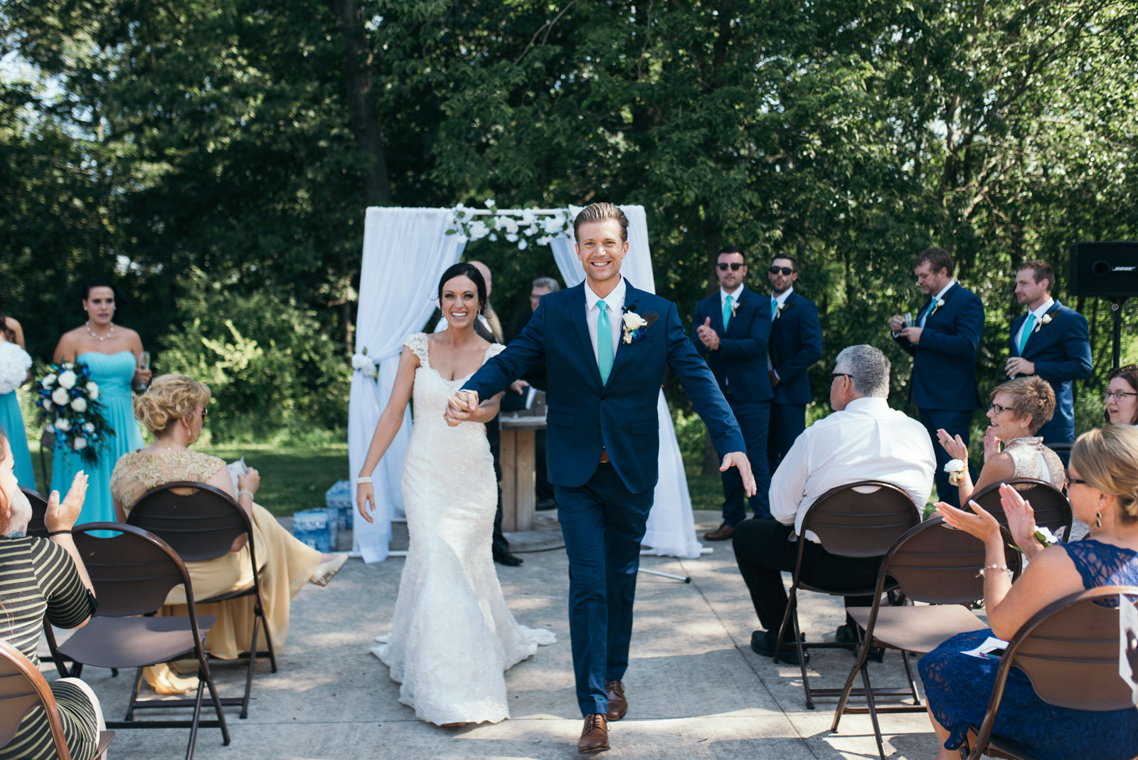 Cedar Rapids Wedding | Squaw Creek Wedding Ceremony | Andrea and Garrett bride and groom walk down aisle after wedding ceremony at squaw creek park