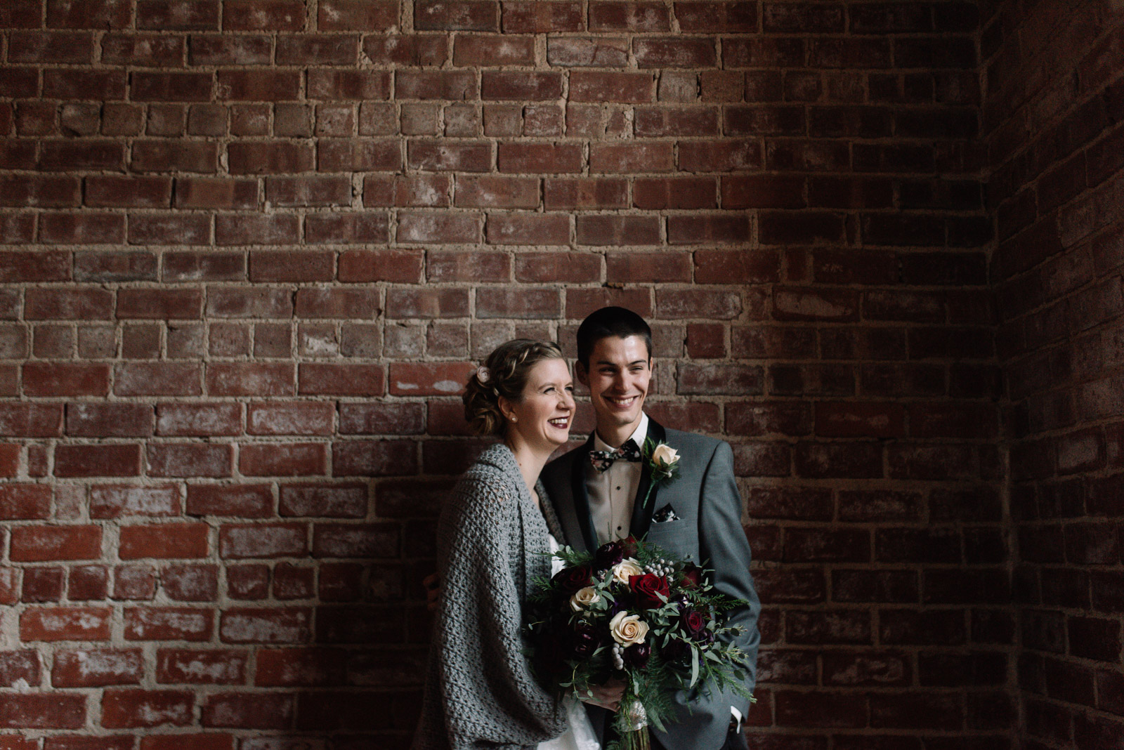 bride and groom at black sheep social club winter wedding