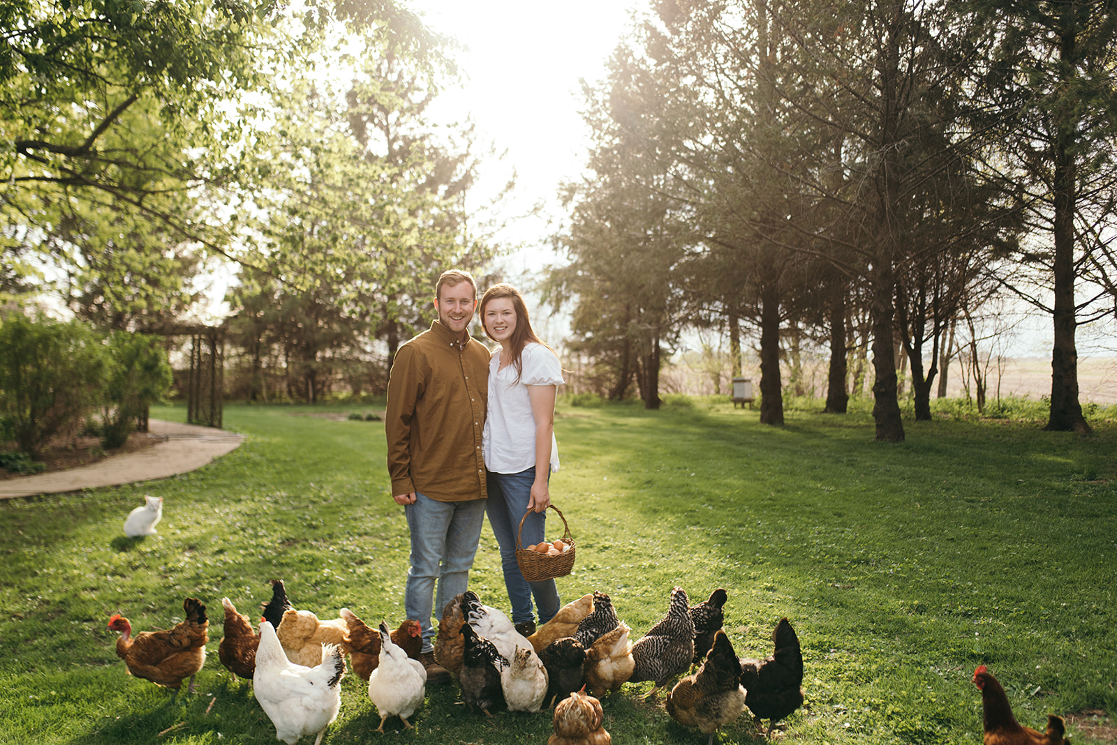 couple-with-chickens-wellman-iowa-engagement-session