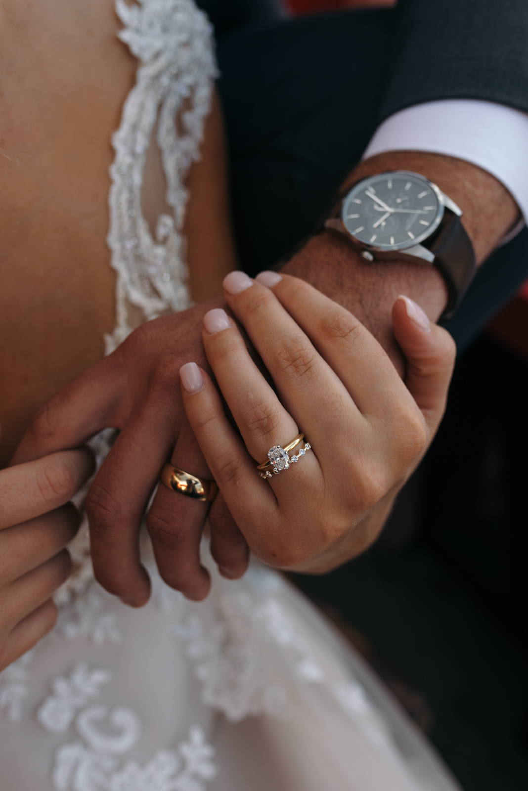 wedding rings on bride and grooms hands
