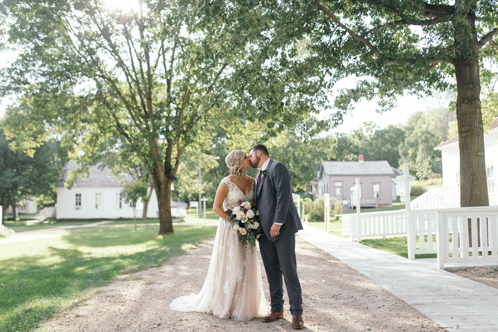 bride and groom kissing Ushers Ferry Historic Village wedding venue September