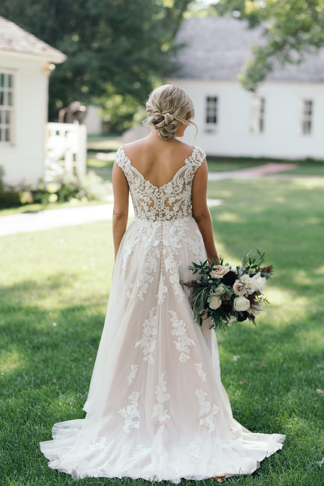 back of brides dress Ushers Ferry Historic Village wedding