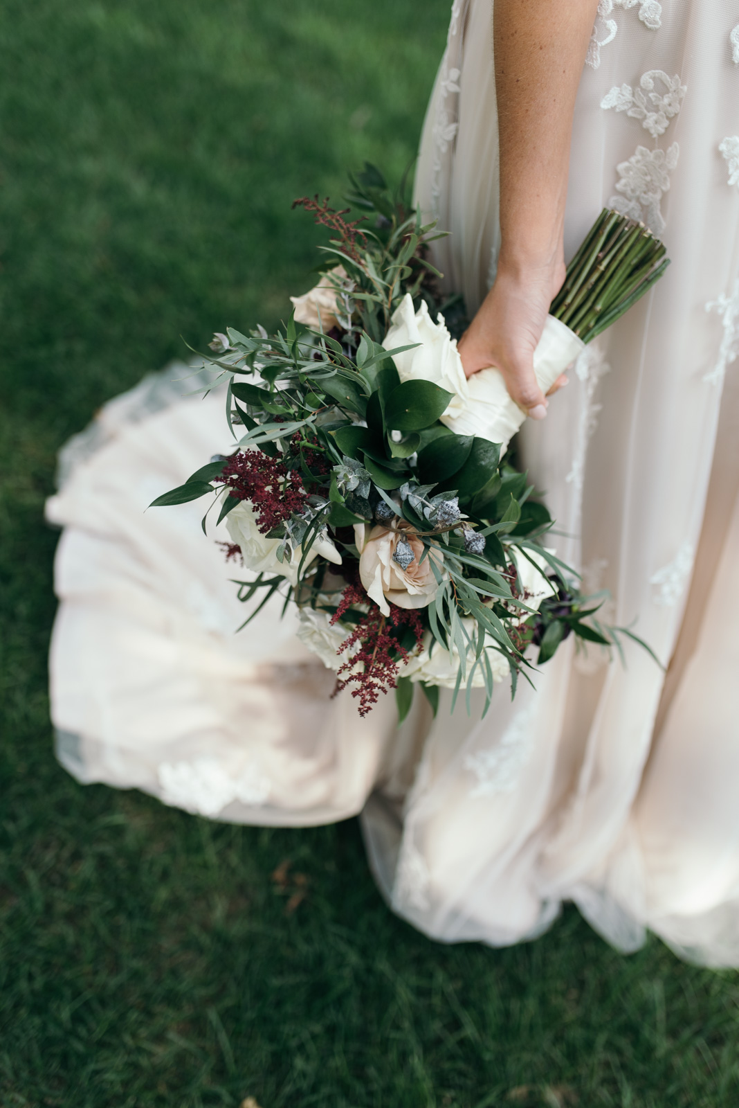 bride holding bridal floral bouquet 