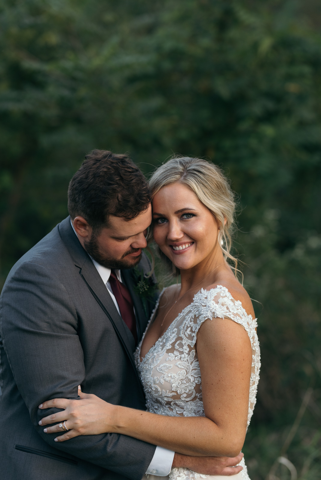 bride and groom cuddling cedar rapids wedding