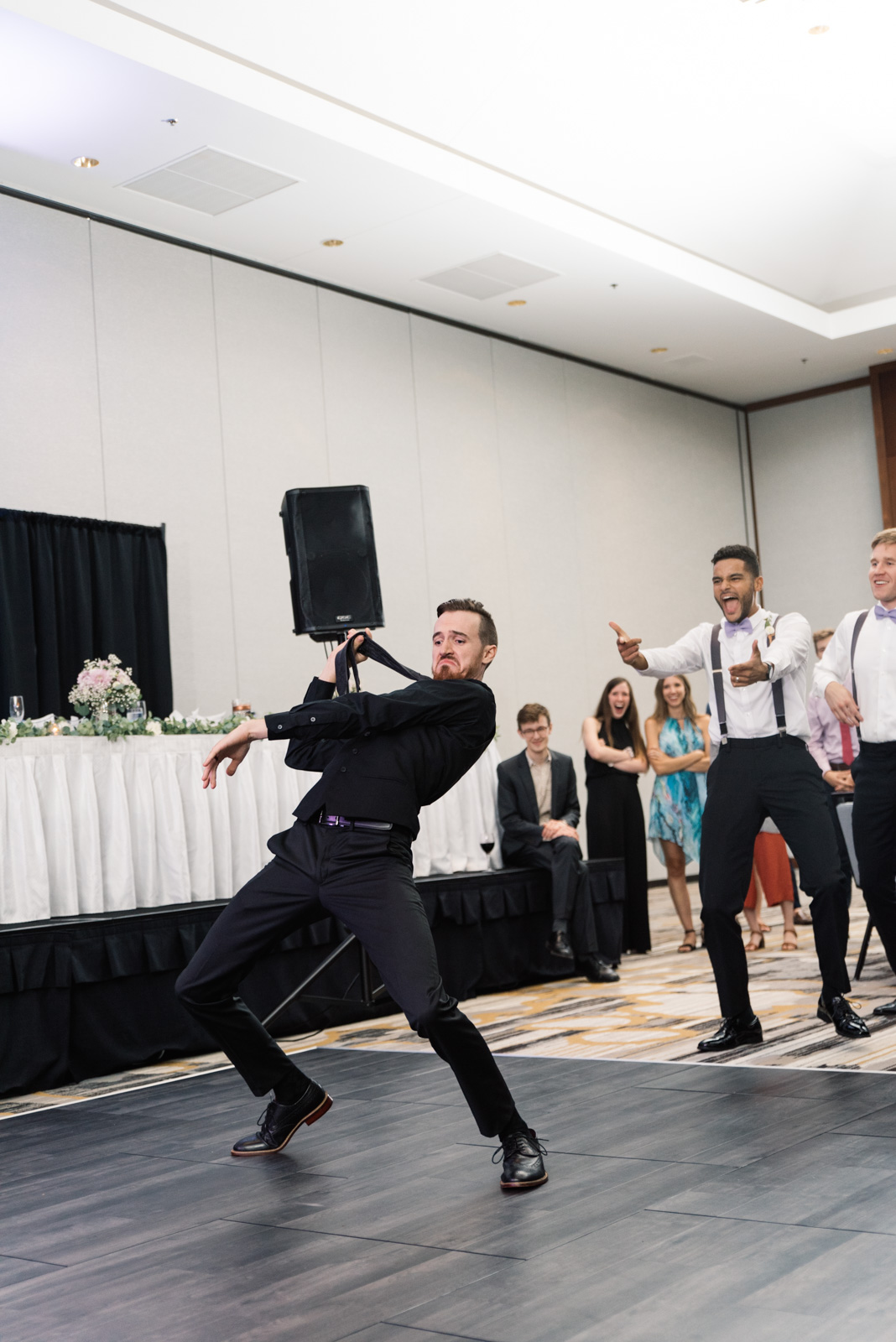 groom in epic dance battle Coralville Marriott Hotel wedding venue