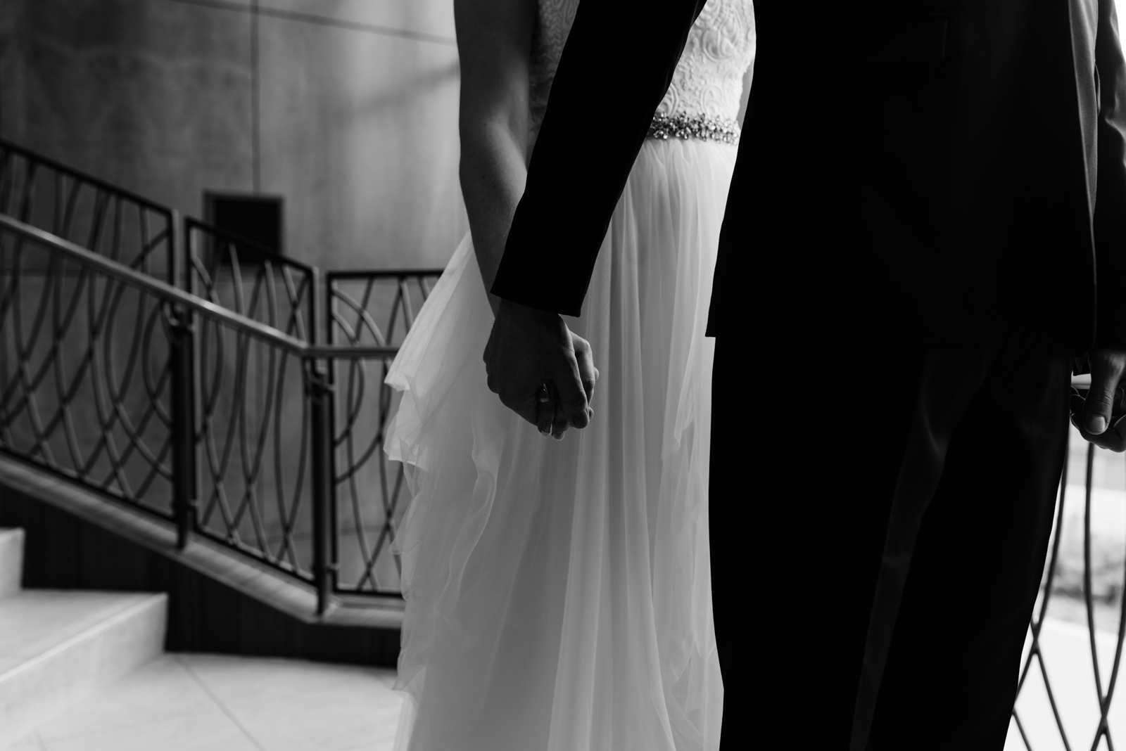 bride and groom holding hands first look Coralville Marriott Hotel Wedding