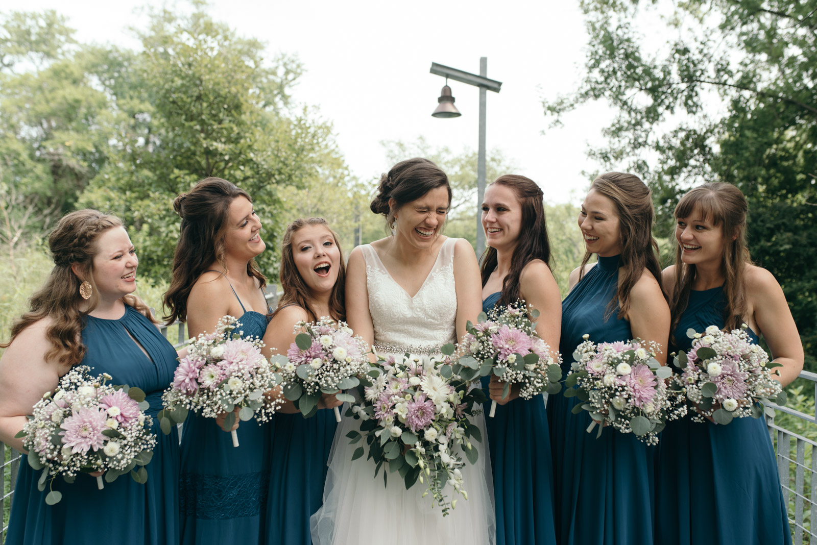 bride with bridesmaids at Coralville Marriott Hotel Wedding