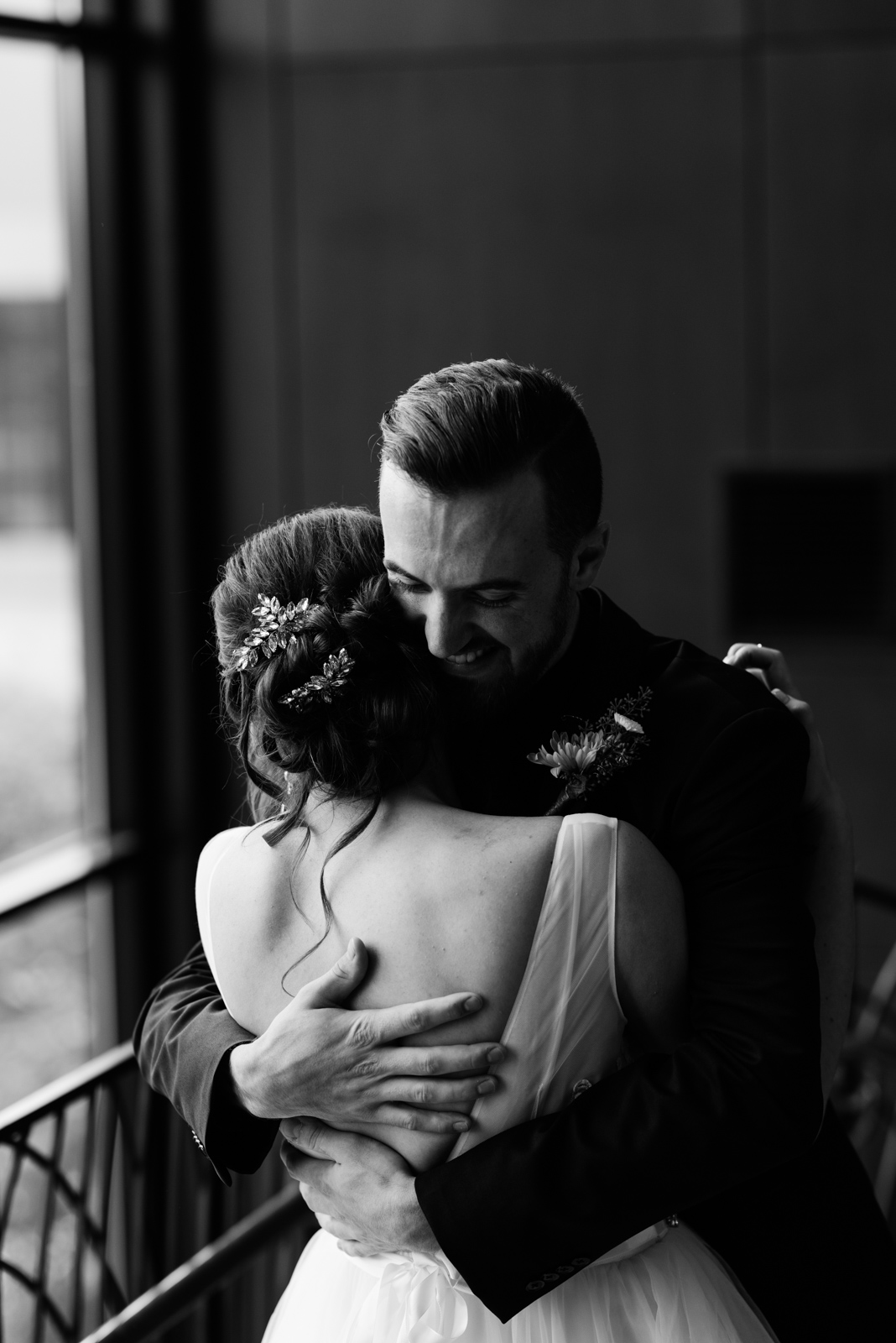 bride and groom hugging Coralville Marriott Hotel Wedding Venue