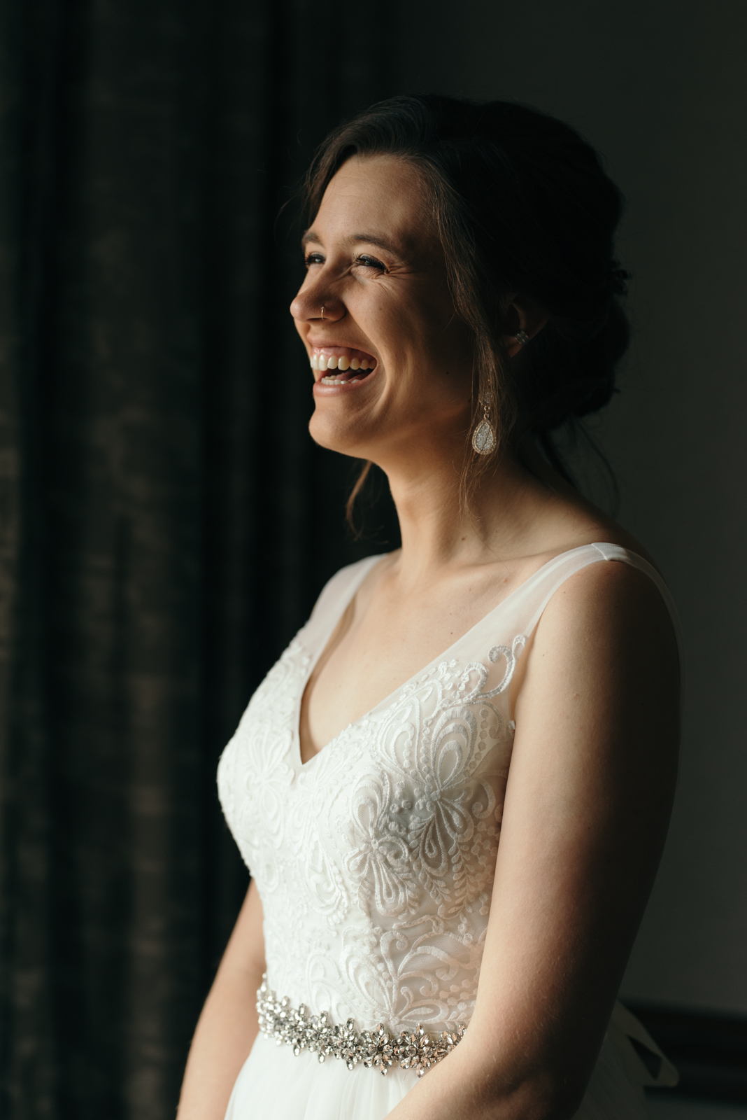 bride laughing Coralville Marriott Hotel Wedding