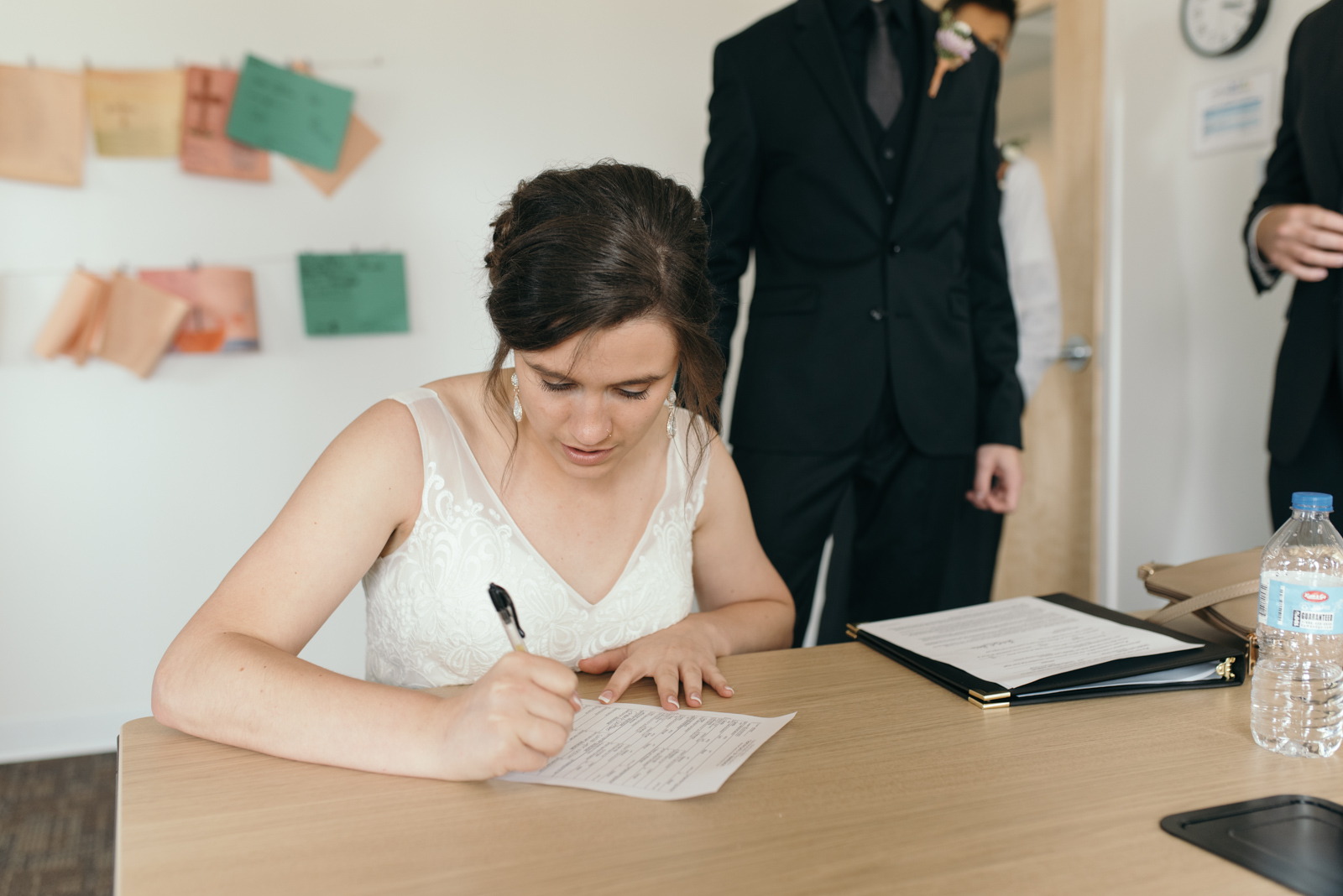 bride signing marriage license Iowa wedding