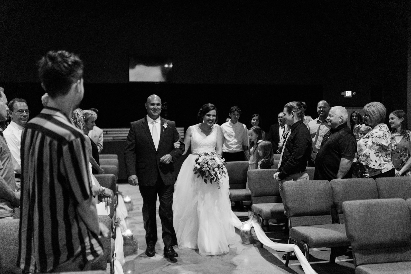 bride walking down aisle veritas church Iowa City wedding ceremony