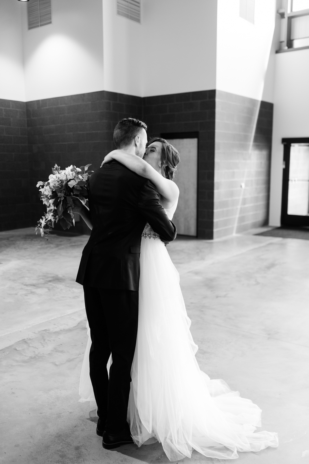 bride and groom kissing after ceremony veritas church Iowa City