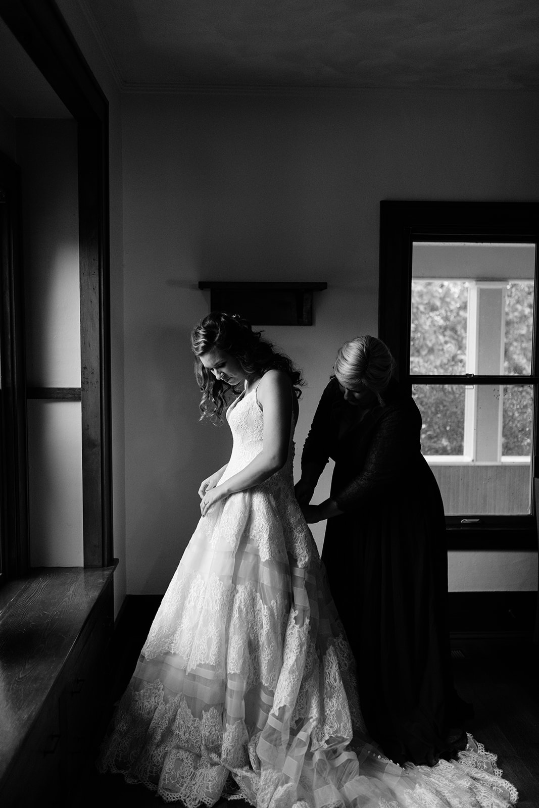 bride getting in wedding dress wellman iowa wedding