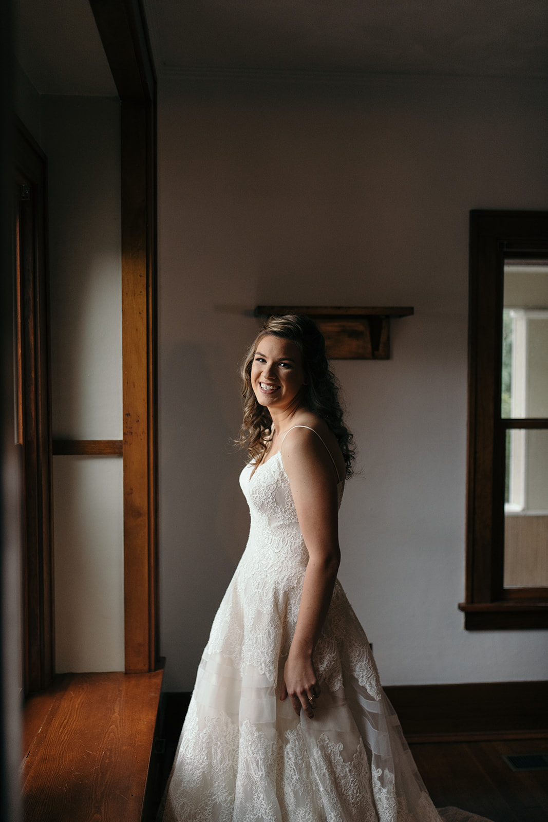 bride in window iowa city wedding