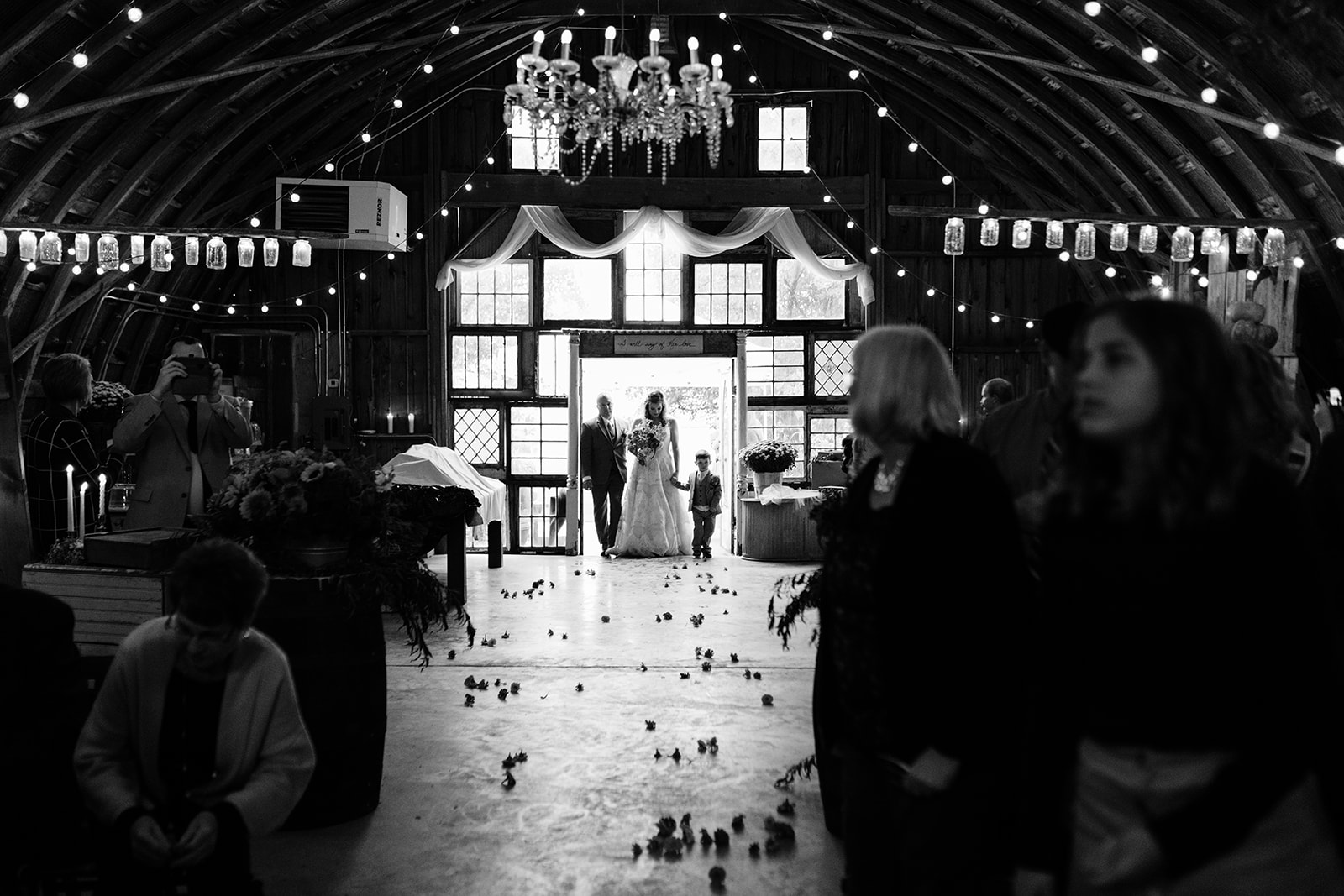 bride walking down the aisle the barn wedding venue