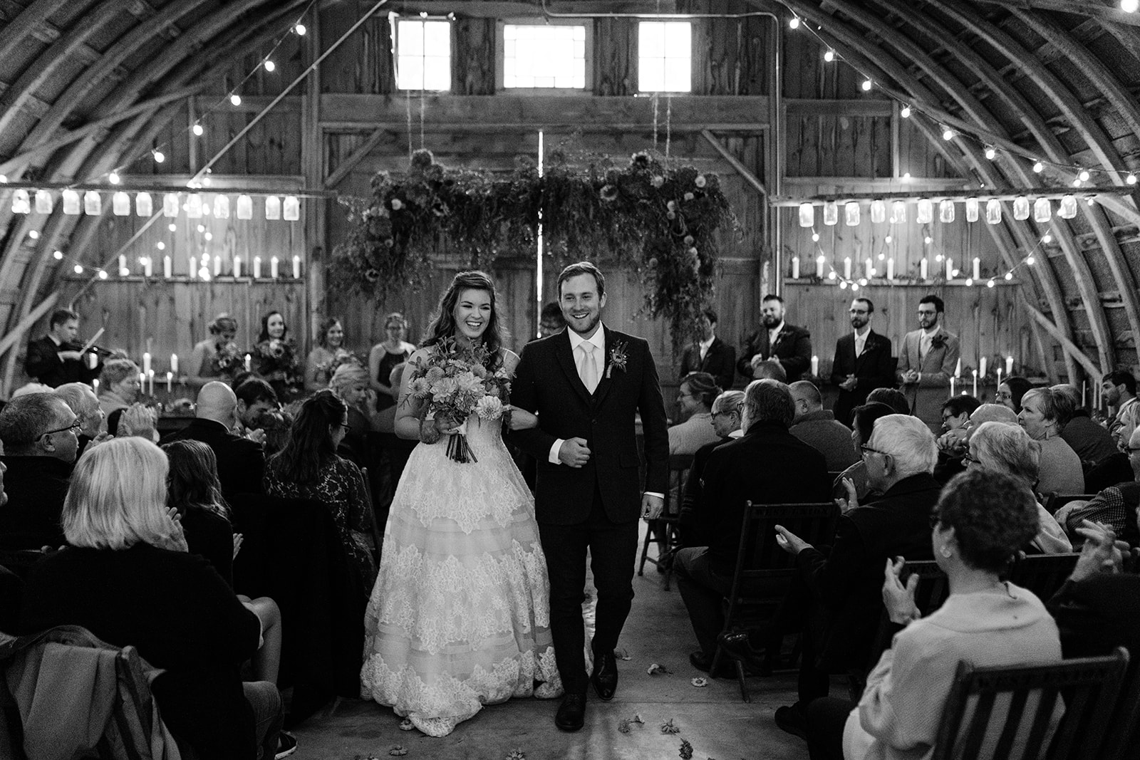 bride and groom walk down the aisle iowa wedding