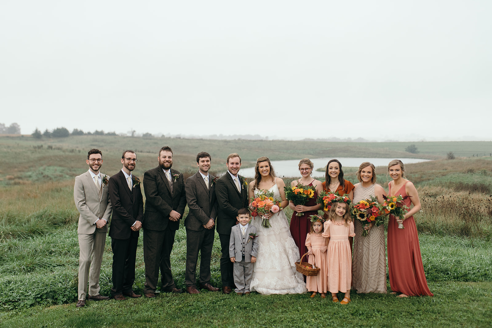 bridal party outside the barn wedding venue iowa fall wedding