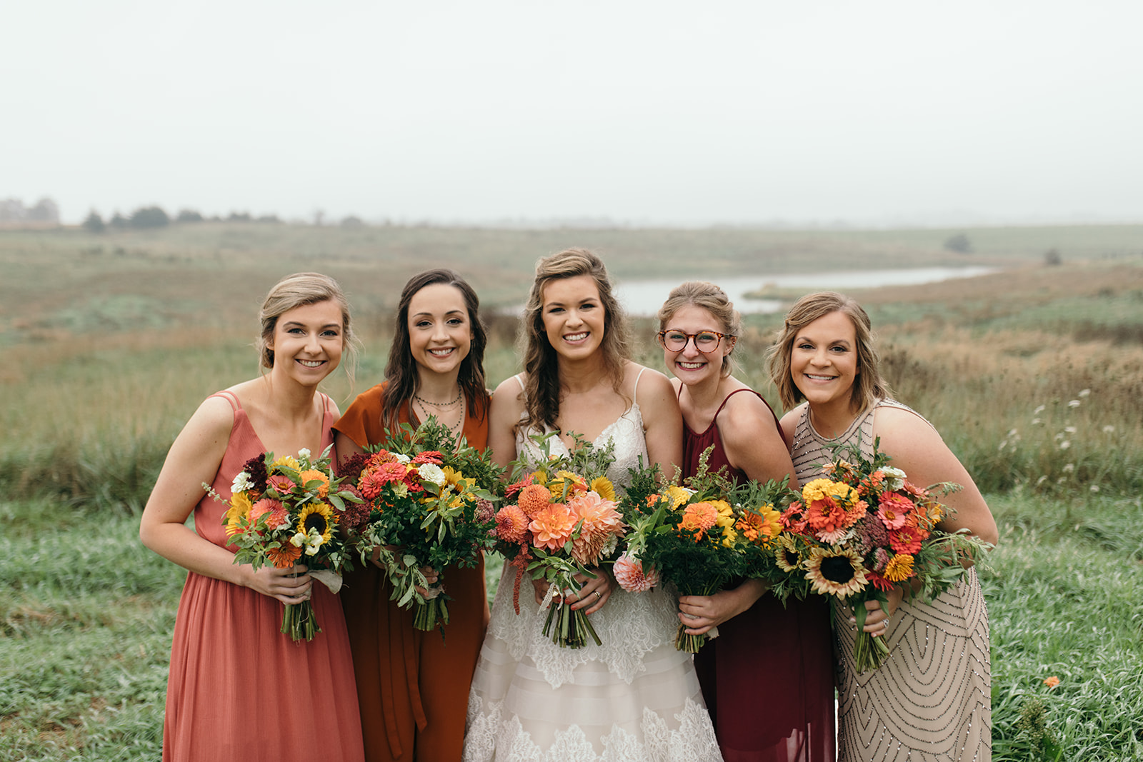 bride with bridesmaids iowa october wedding