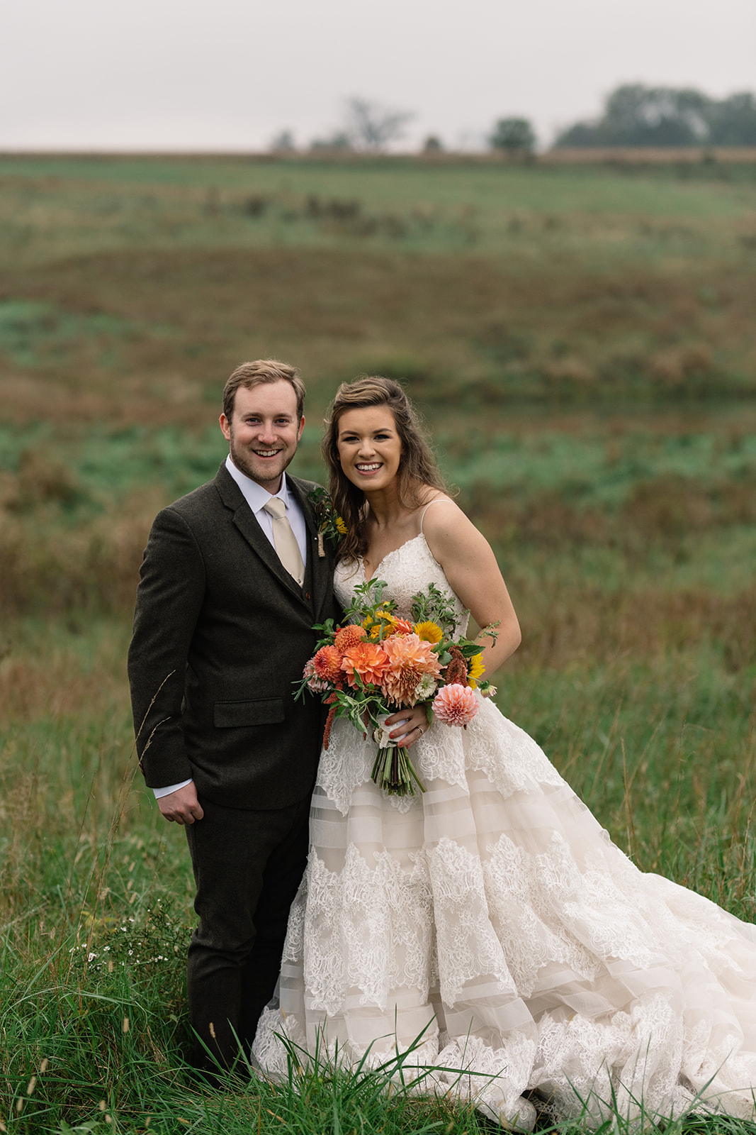 bride and groom in field iowa fall wedding