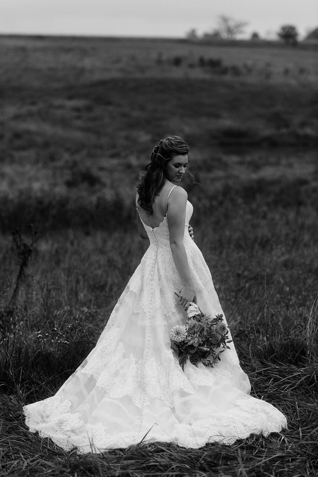 bride in field iowa city fall wedding