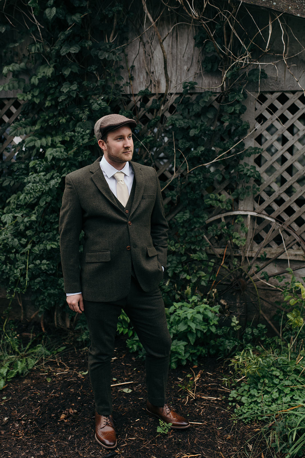 groom in tweed suit and hat iowa october wedding