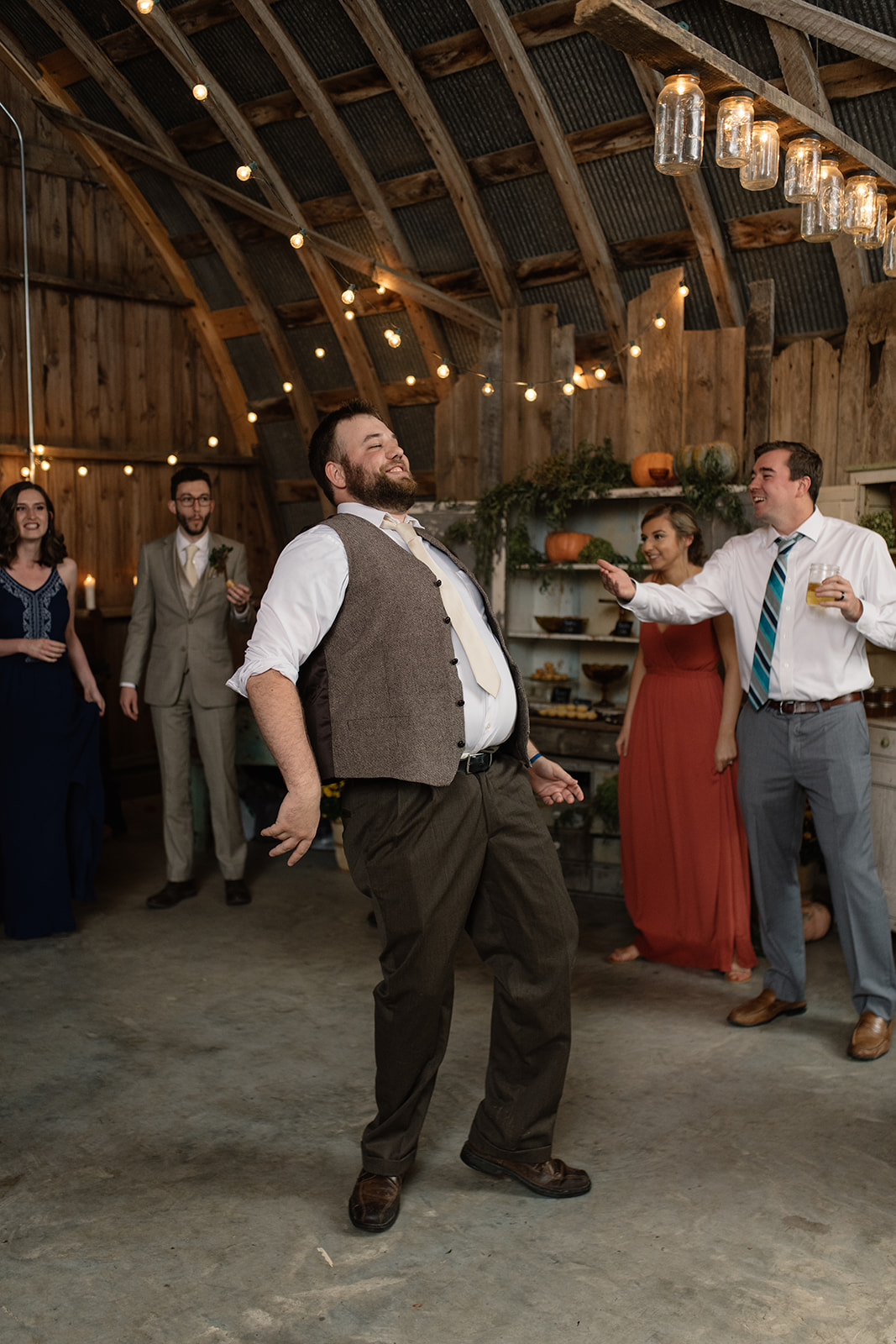 wedding guest dancing string lights iowa city wedding reception