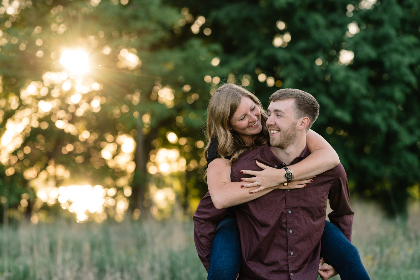 couple piggy back ride cedar falls june engagement