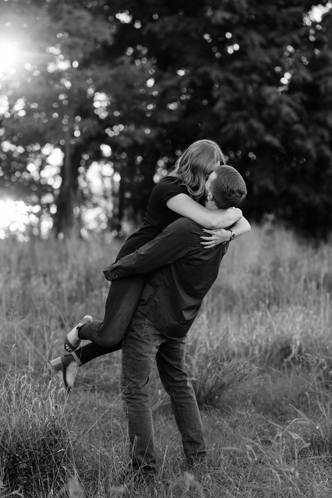 couple spinning in field george wyth state park engagement