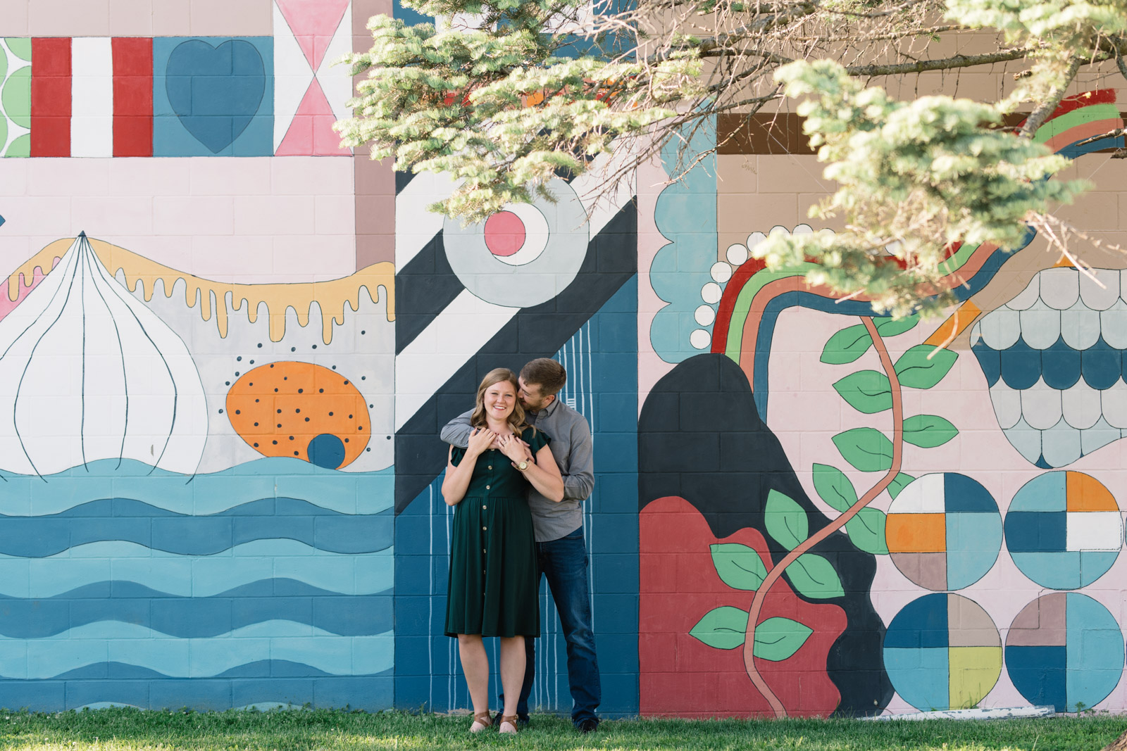 couple in front of mural cedar falls