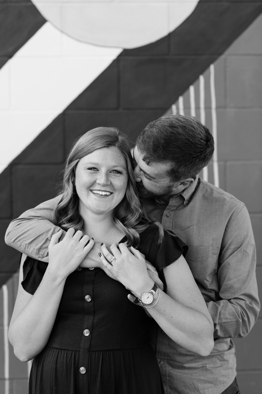 couple in front mural cedar falls engagement