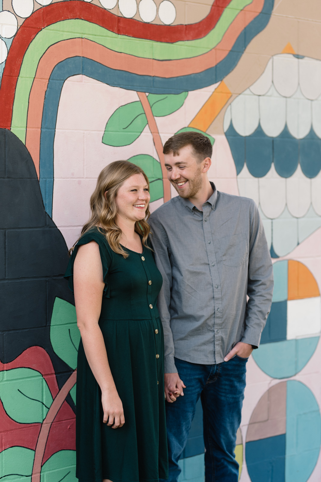 couple in front mural cedar falls engagement
