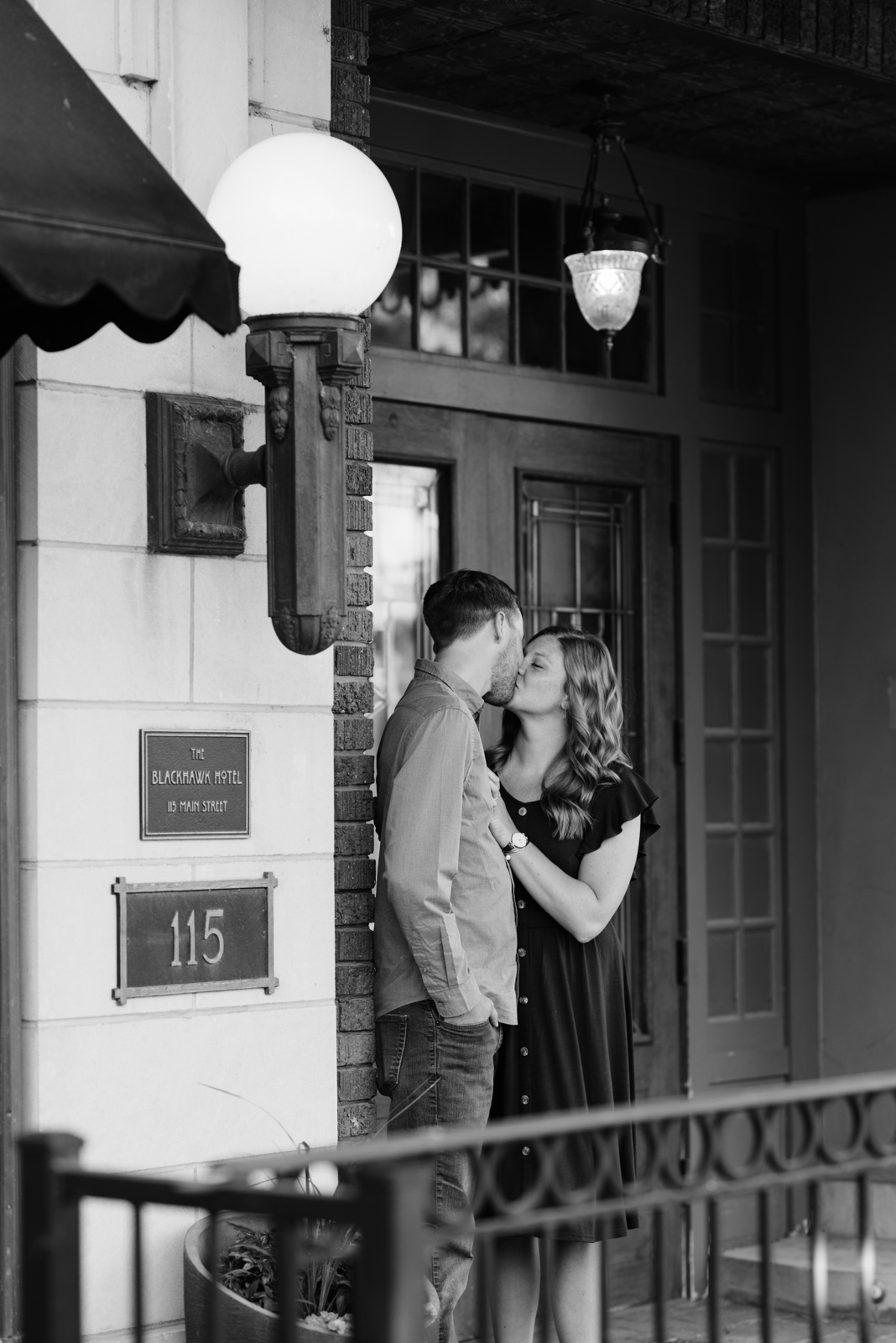 couple kissing outside cedar falls engagement session