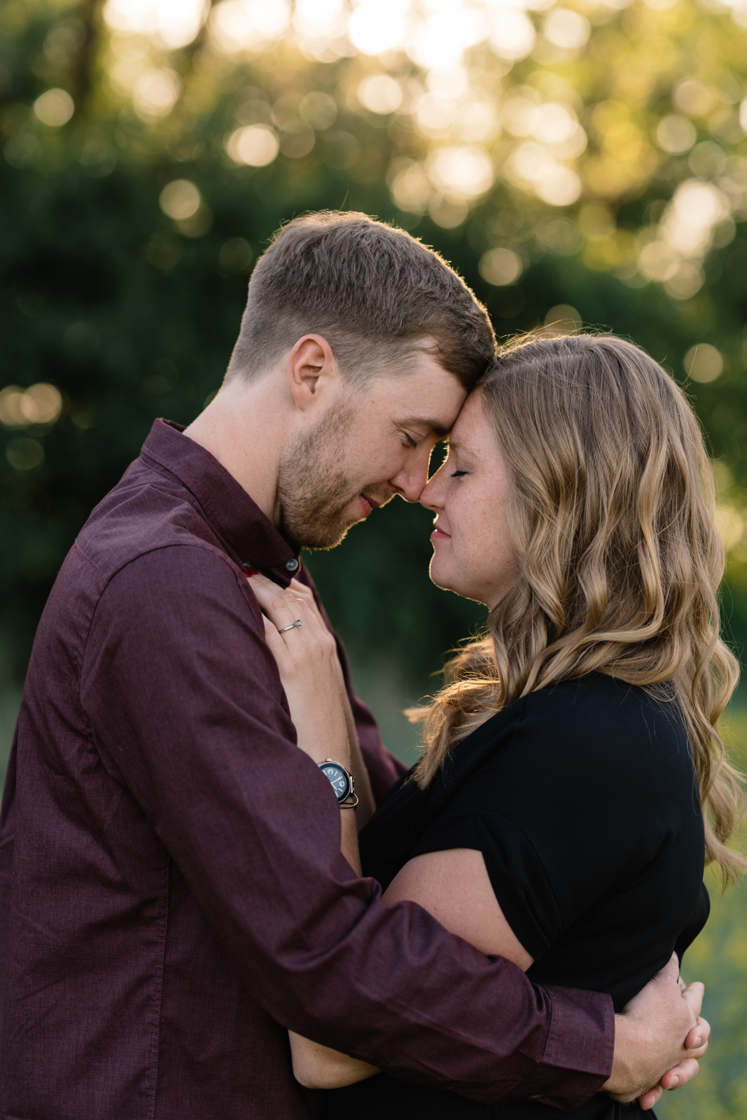 couple cuddling cedar falls June engagement session