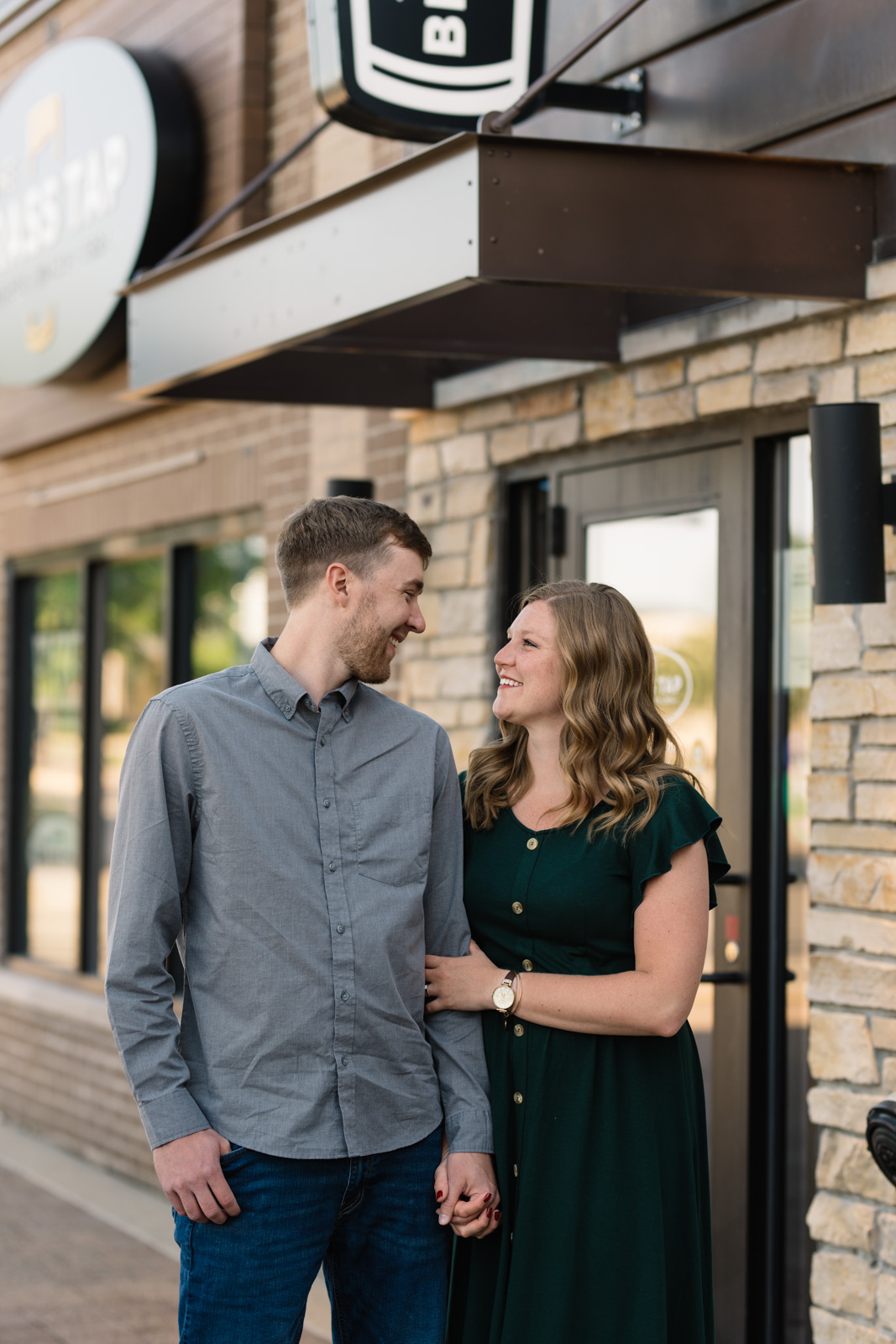 engaged couple on main street cedar falls