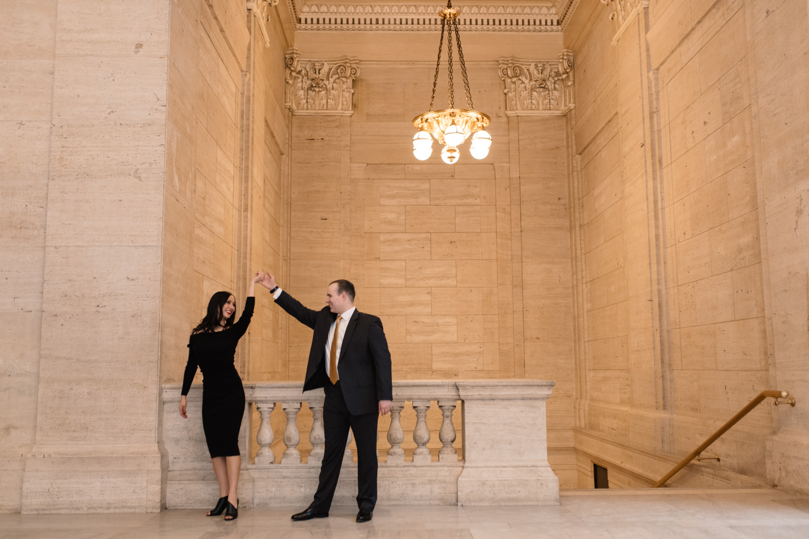 couple dancing at chicago union station engagement