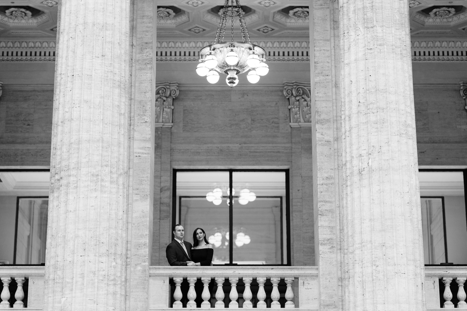 couple on balcony chicago union station engagement