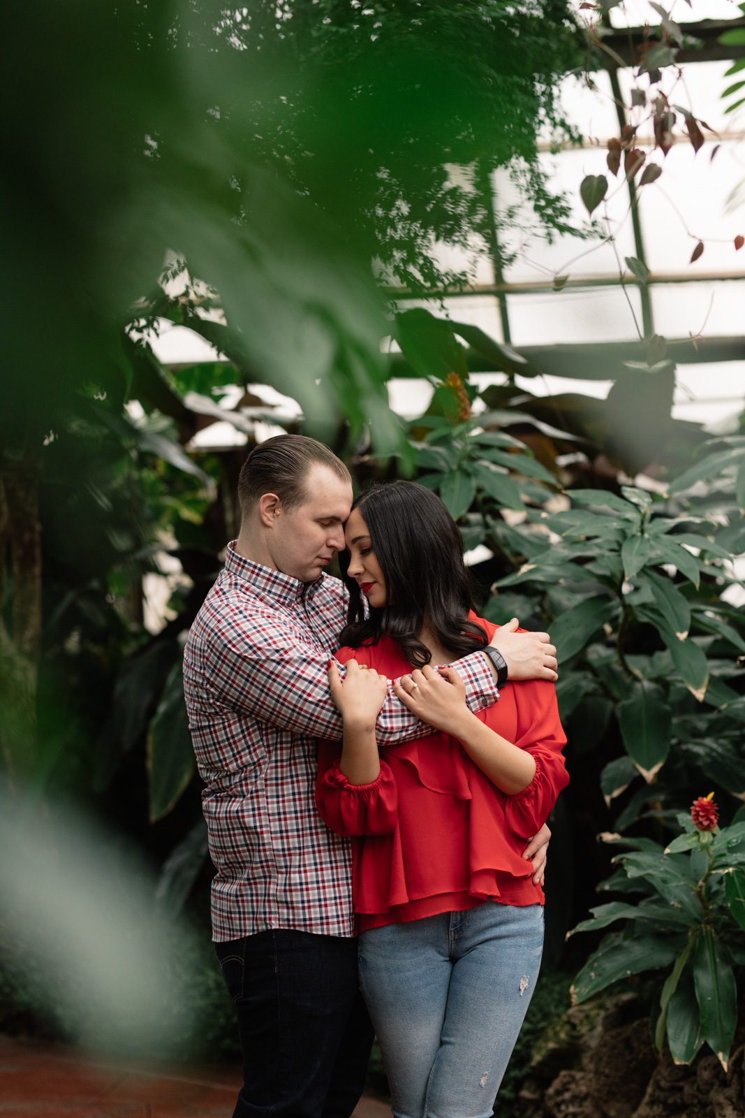 couple hugging lincoln park conservatory engagement session