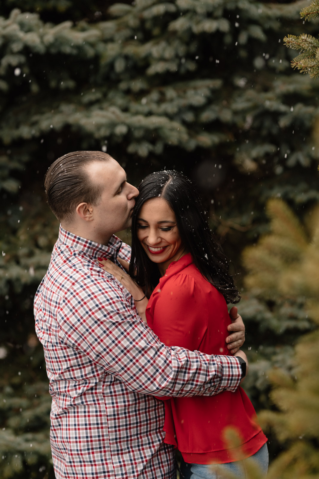 couple cuddling chicago winter engagement session