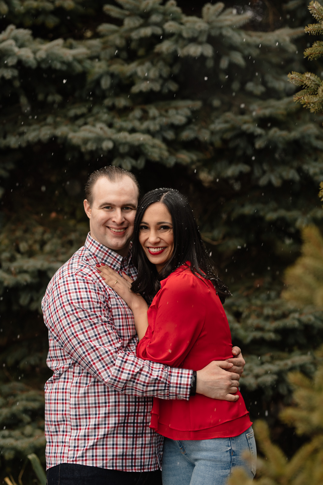 couple hugging snowy chicago engagement session