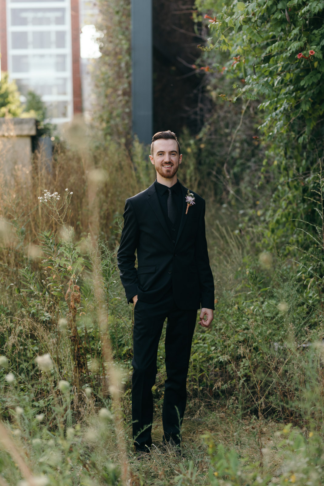 groom smiling outside Coralville wedding