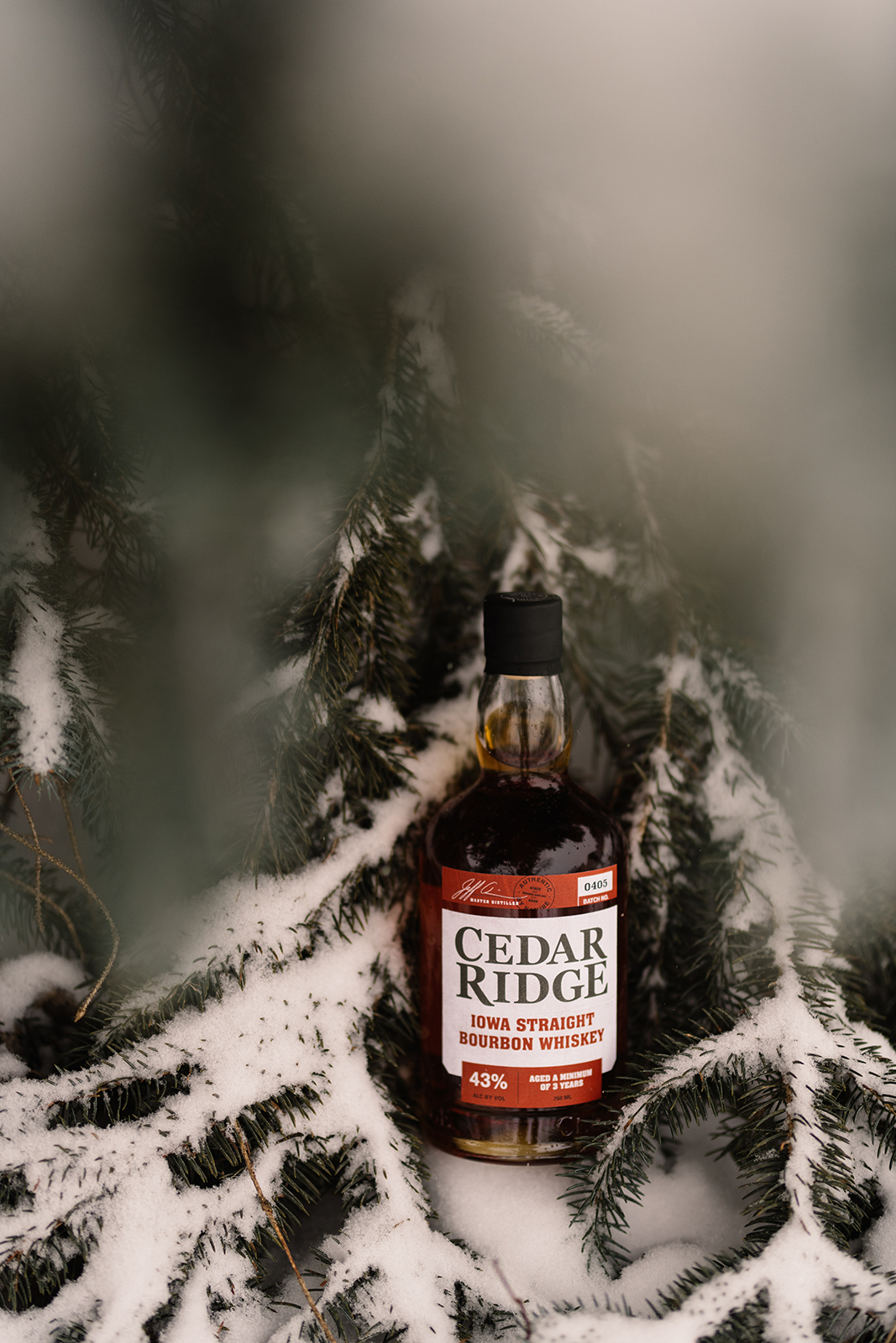 cedar ridge winery bourbon pouring into glass in the snow cedar rapids iowa