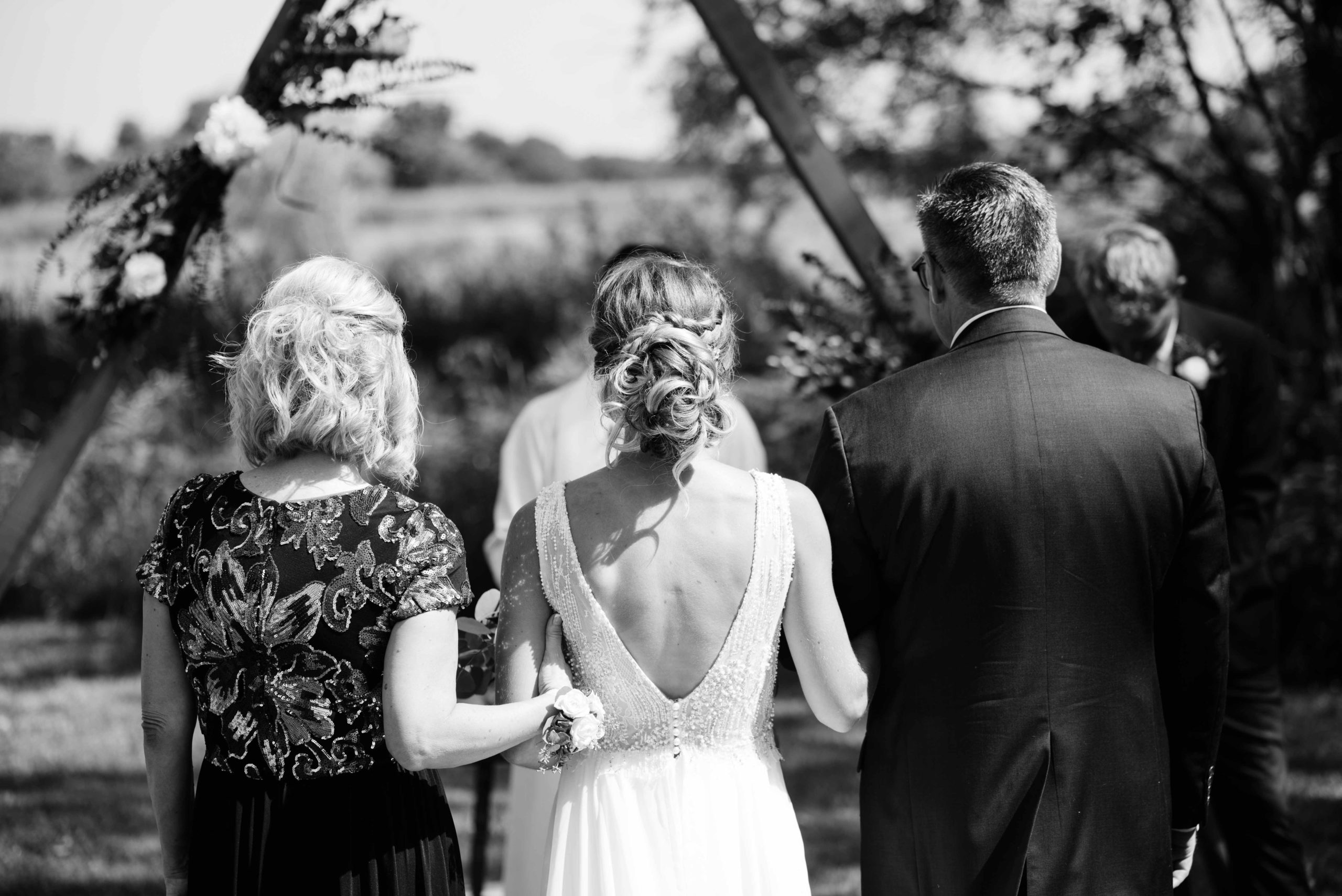 groom crying as he sees his bride for the first time outdoor Iowa wedding ceremony schafer century barn wedding venue