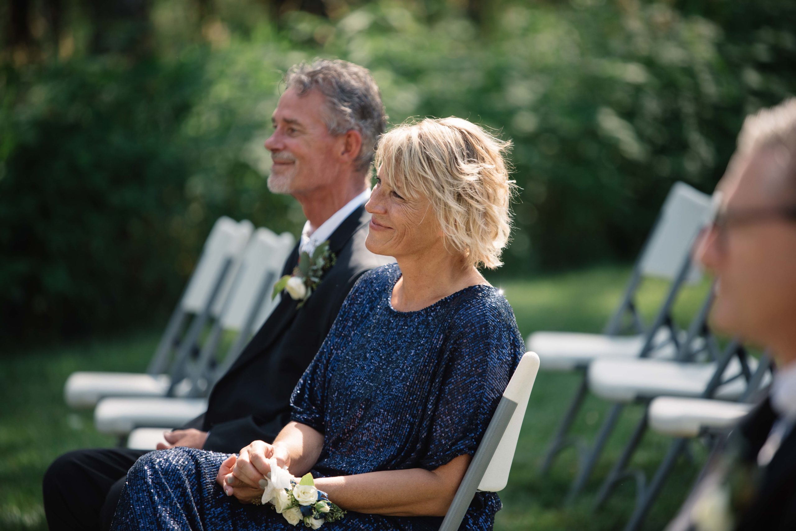 groom crying as he sees his bride for the first time outdoor Iowa wedding ceremony schafer century barn wedding venue