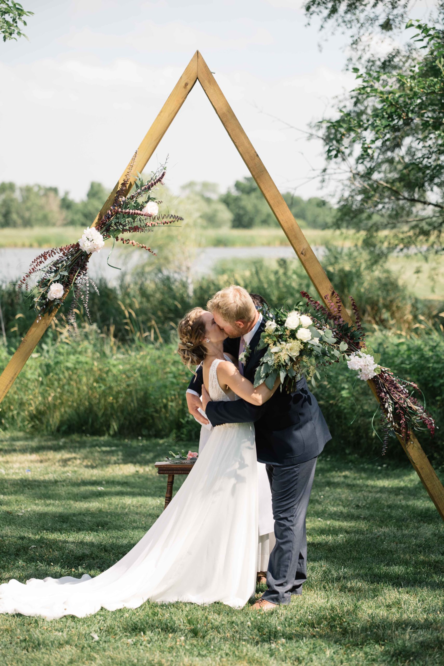 groom crying as he sees his bride for the first time outdoor Iowa wedding ceremony schafer century barn wedding venue