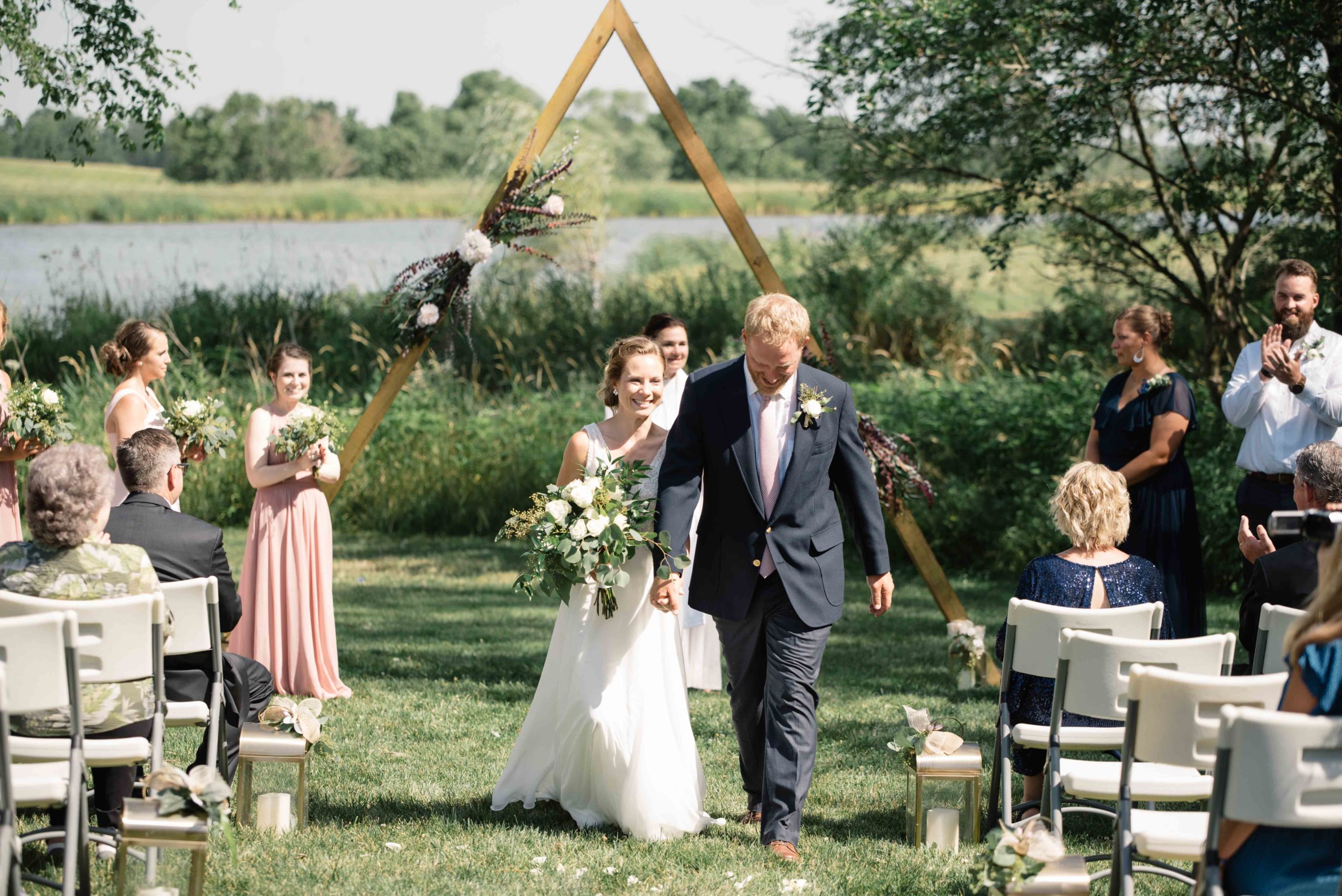 groom crying as he sees his bride for the first time outdoor Iowa wedding ceremony schafer century barn wedding venue