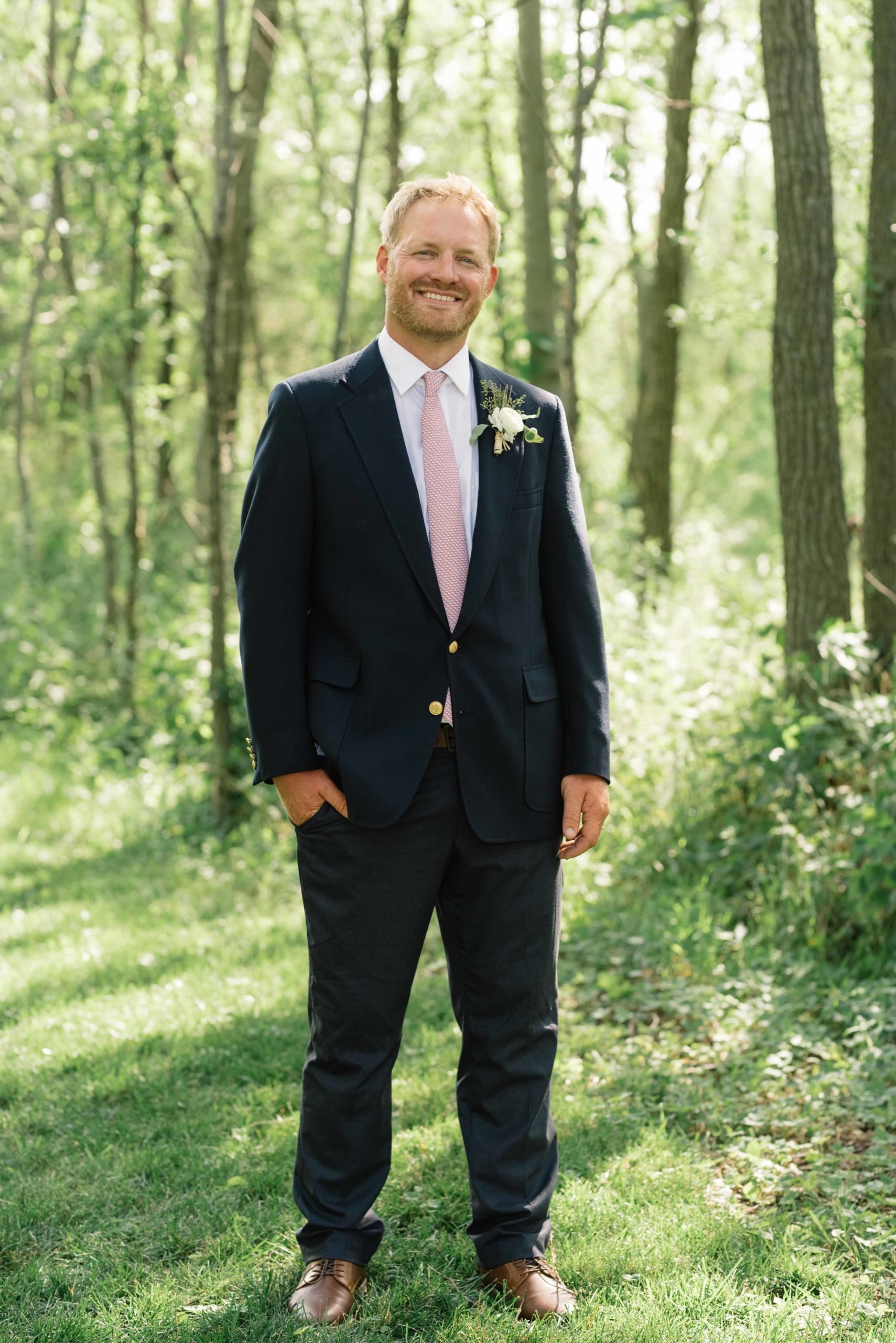 groom smiles for portrait schafer century barn wedding venue