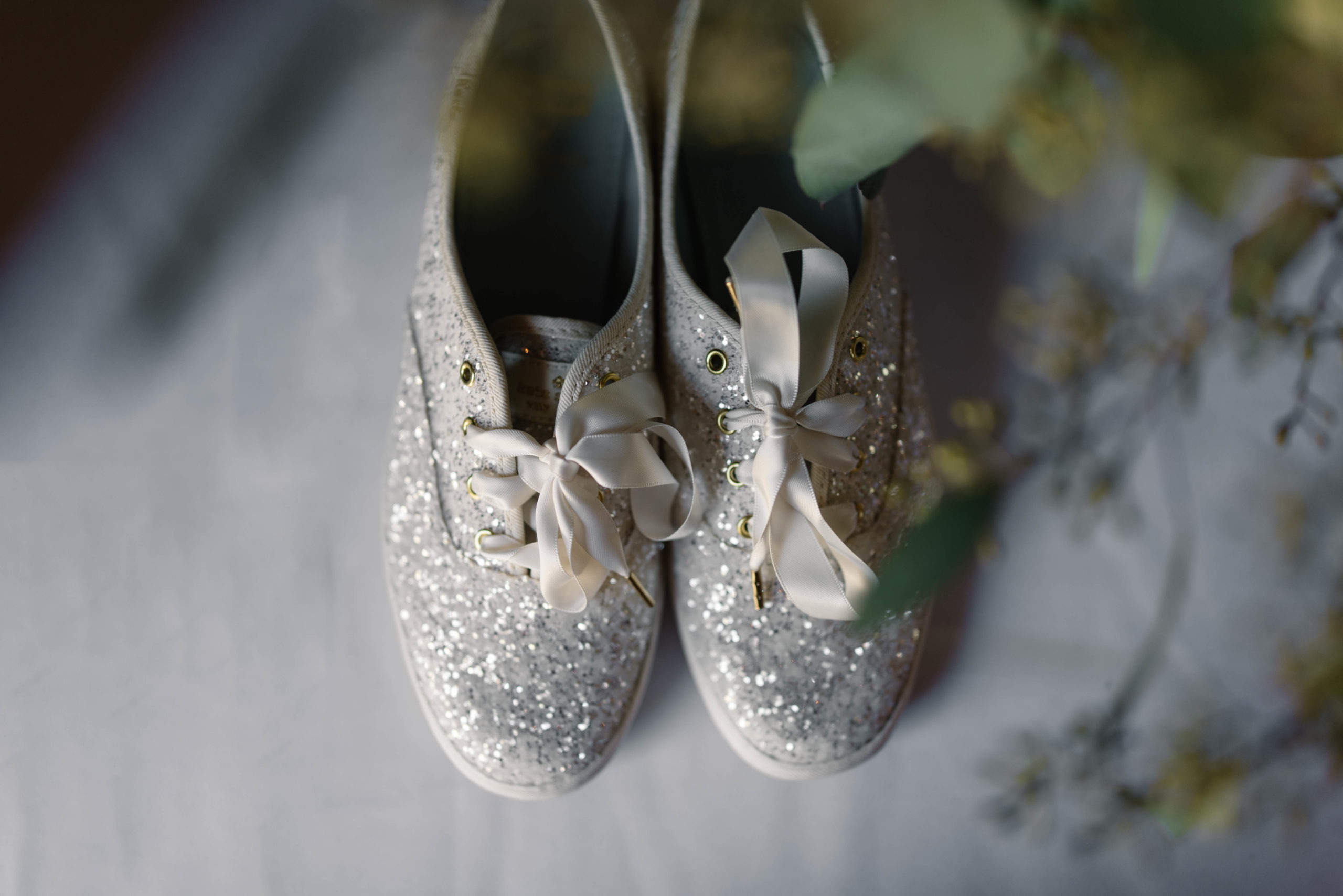 sparkle Kate Spade Keds wedding shoes with white rose weddin bouquet schafer century barn wedding venue