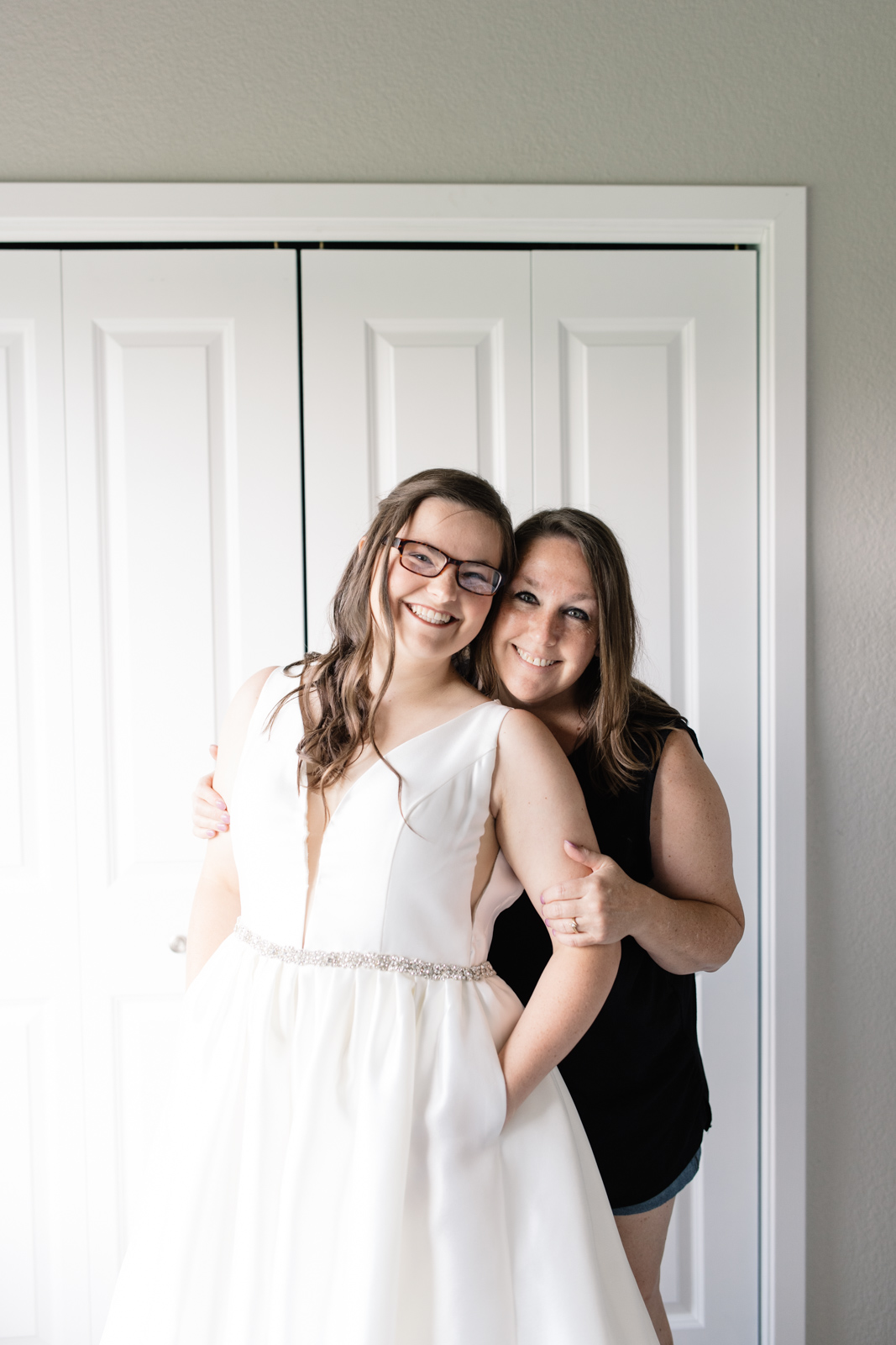 mother of the bride and bride smiling