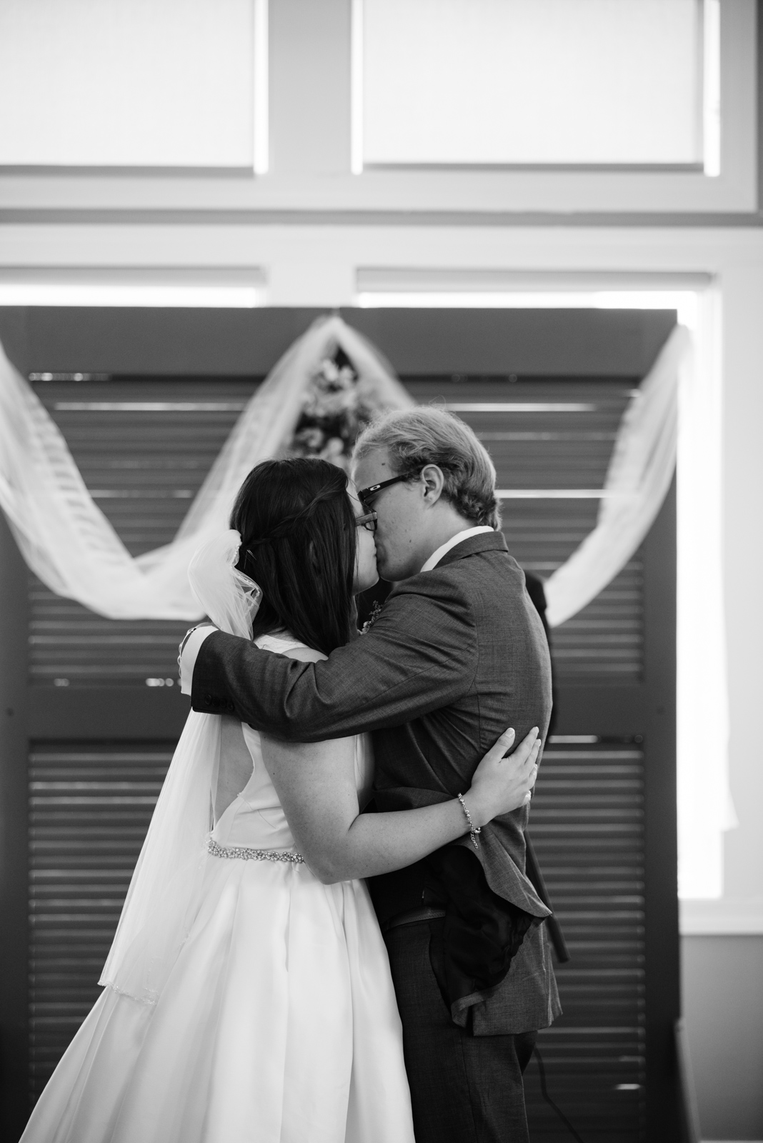 bride and groom first kiss fox ridge golf wedding venue