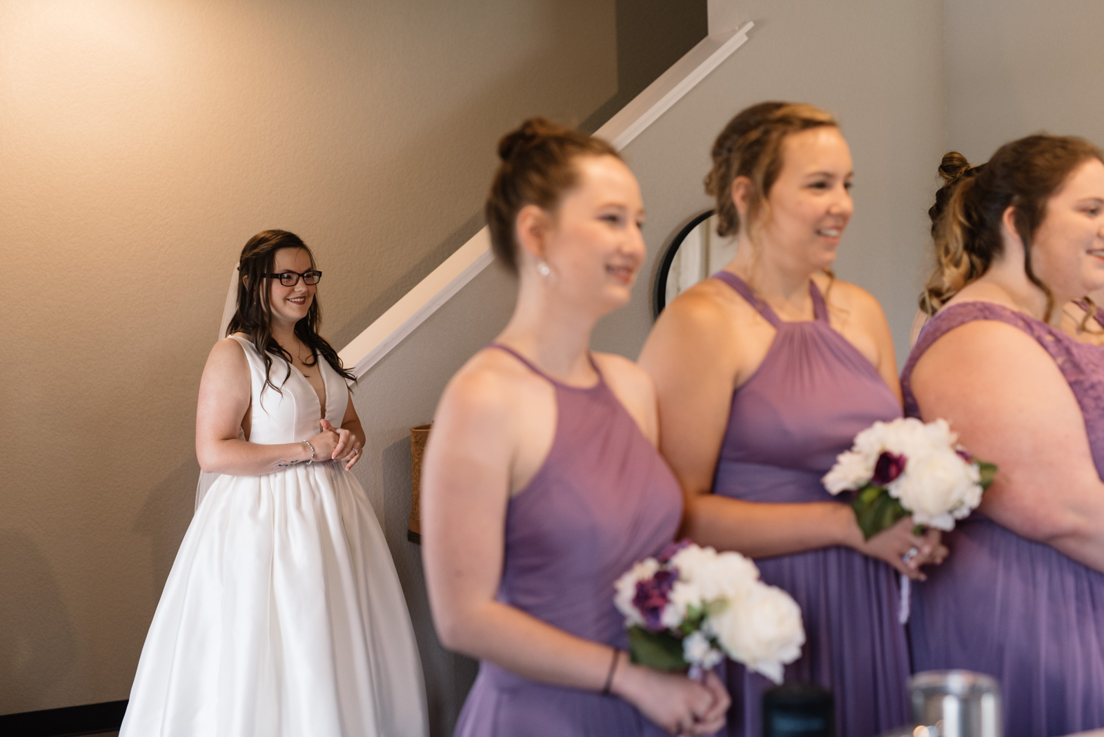 bride first look with bridesmaids